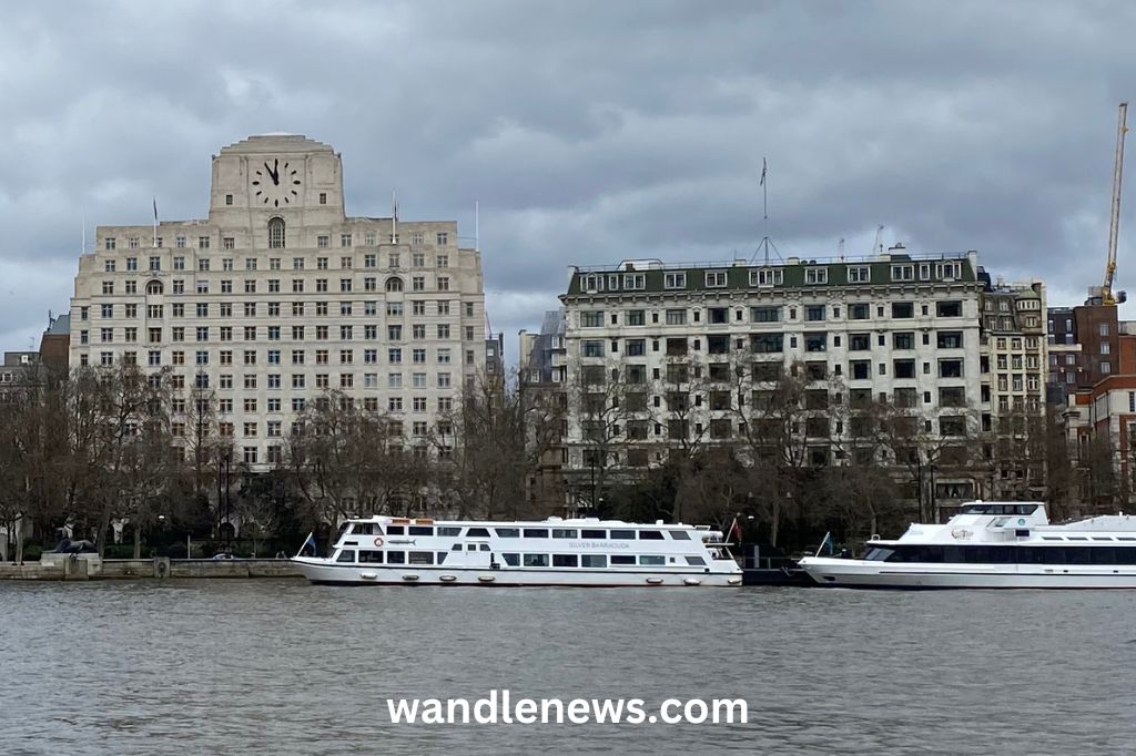 Savoy hotel on the right next to Shell Mex House on the left