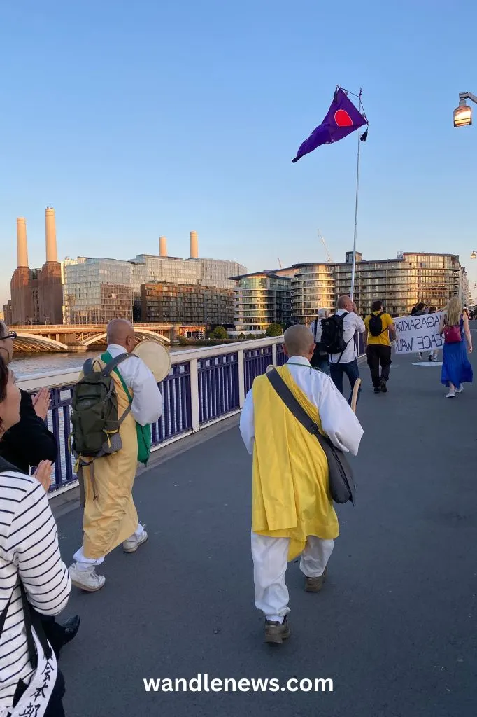 Crossing Chelsea Bridge, with Battersea Power Station in the background